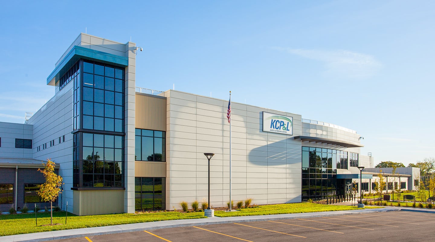 front facade with white panels and sign